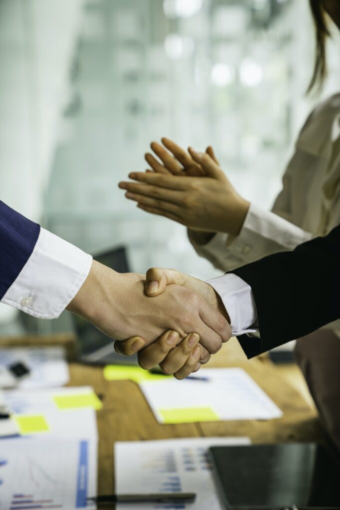 Businessman shakes hands and hands after a successful business deal, handshake to congratulate with