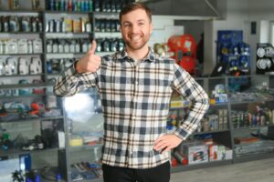 A salesman in an auto parts store. Retail trade of auto parts