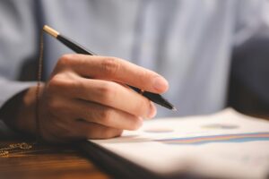 Professional businessman or worker signing job contract, person being employed at new position