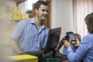 Customer using credit card reader at store